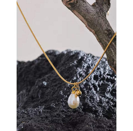 Dainty Fresh Water Pearl Pendant in Rat Tail Necklace | Erika Williner Designs