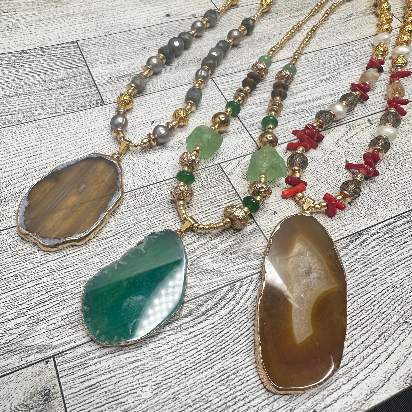 Brown Agate Pendant with Smoky Faceted Crystals, Red Coral Branches, Faceted Citrines, Fresh Water Pearls, Lava Rock and Golden Glass seed Beads | Erika Williner Designs