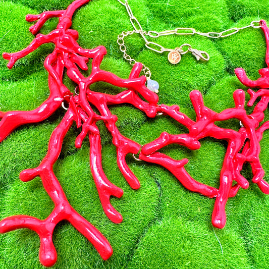 close up view of red coral necklace