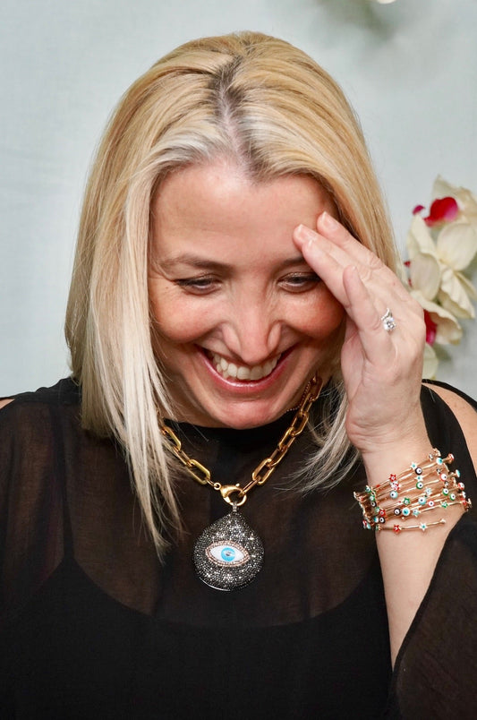 Gold Plated Chain Link Necklace it has a Mother of Pearl Pendant Embellished with Pave Crystals and a cute Evil Eye