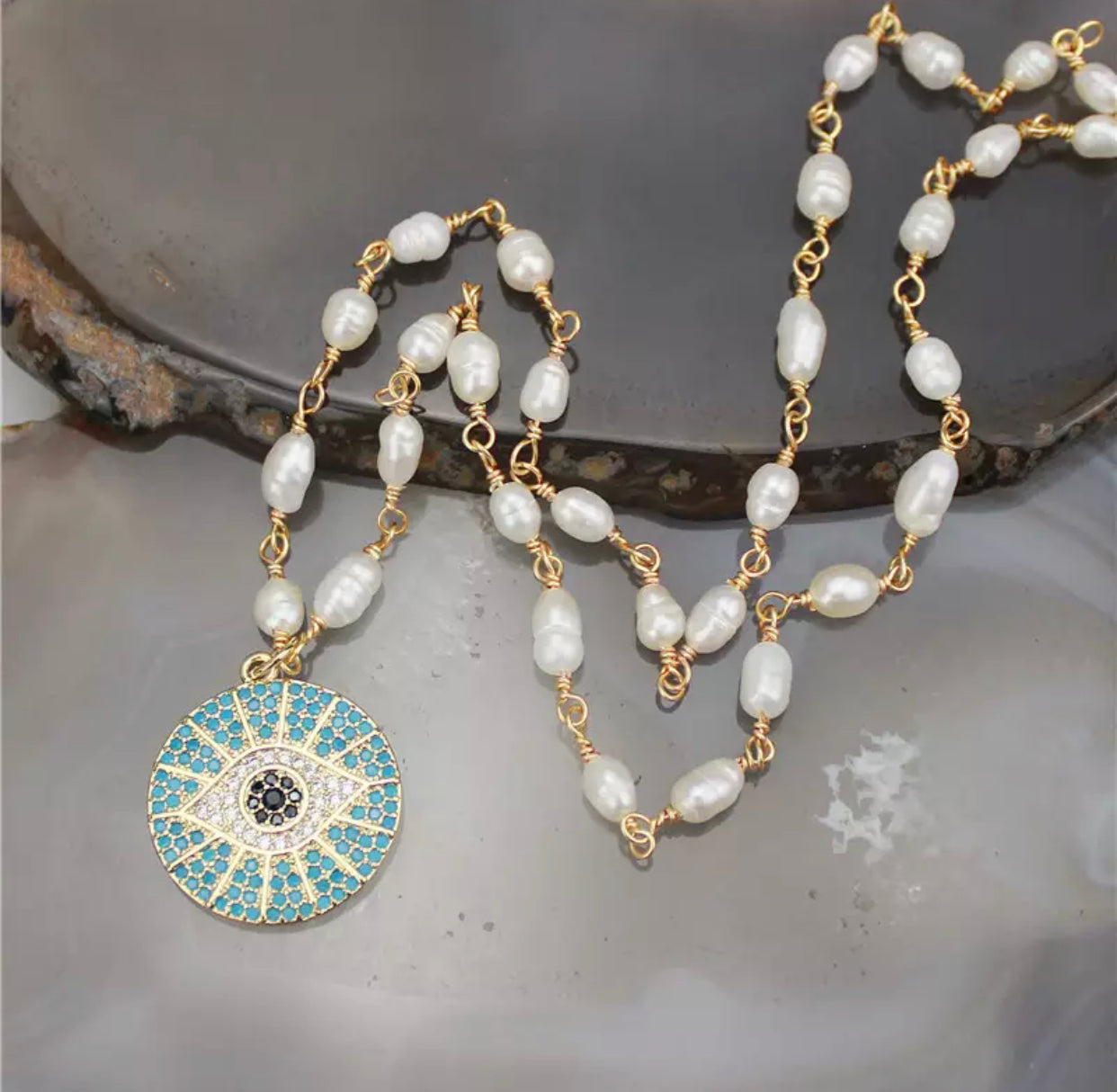 chain with a pave crystal evil eye pendant