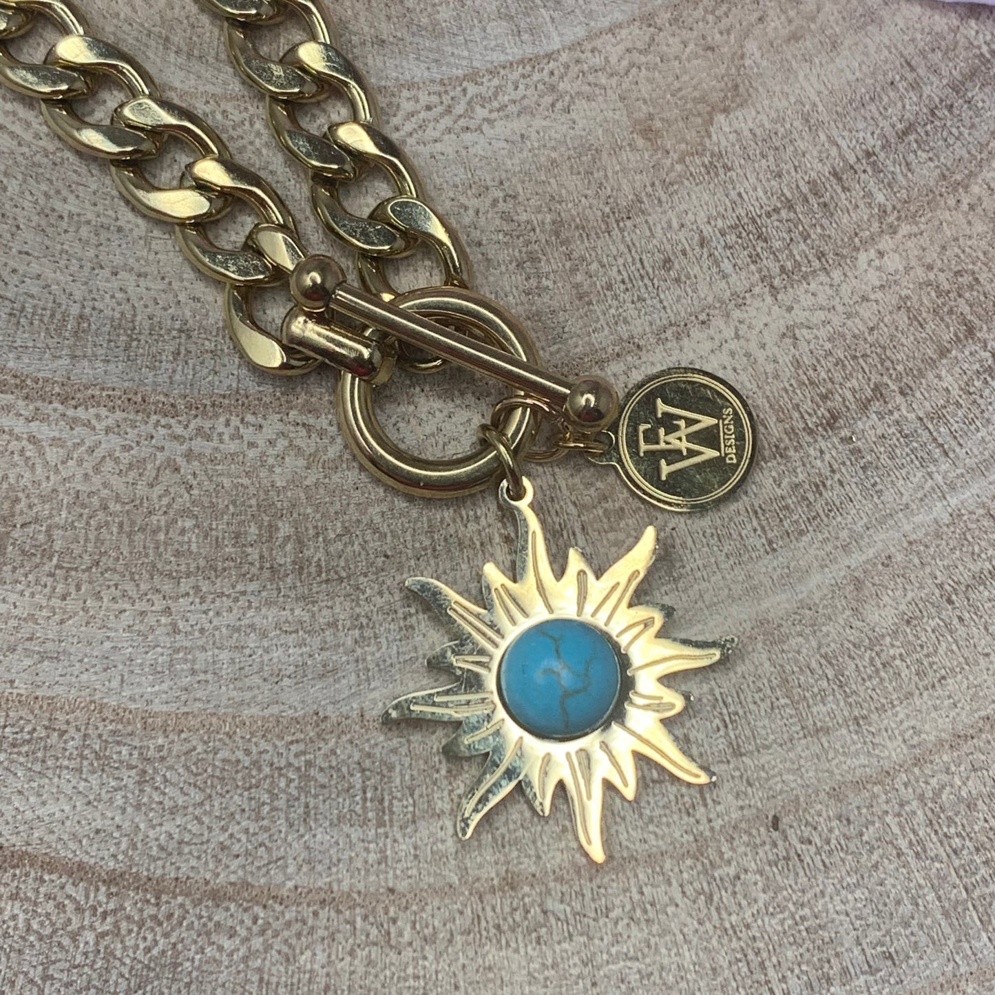Stainless Chain Linxs with a Sun Shape Pendant and a gemstone in it