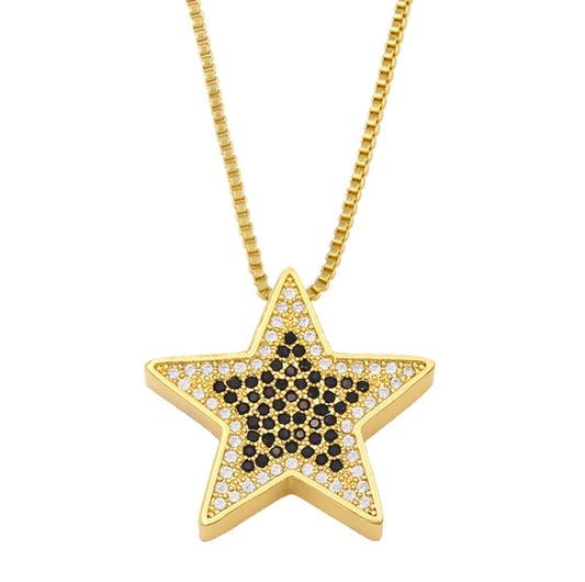 Gold Plated necklace features a gold star embellished with black pave crystals
