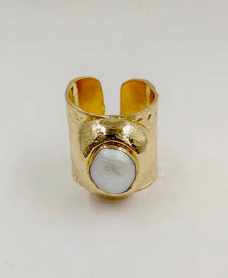 Cuff ring with a faceted stone C