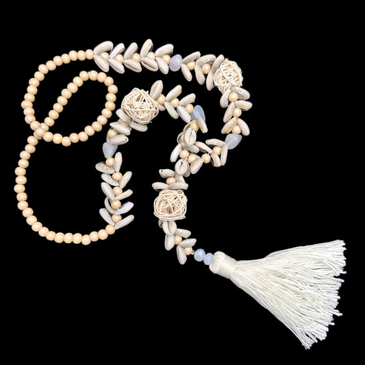 Cowry shells and raffia beads with cotton tassel necklace | Erika Williner Designs