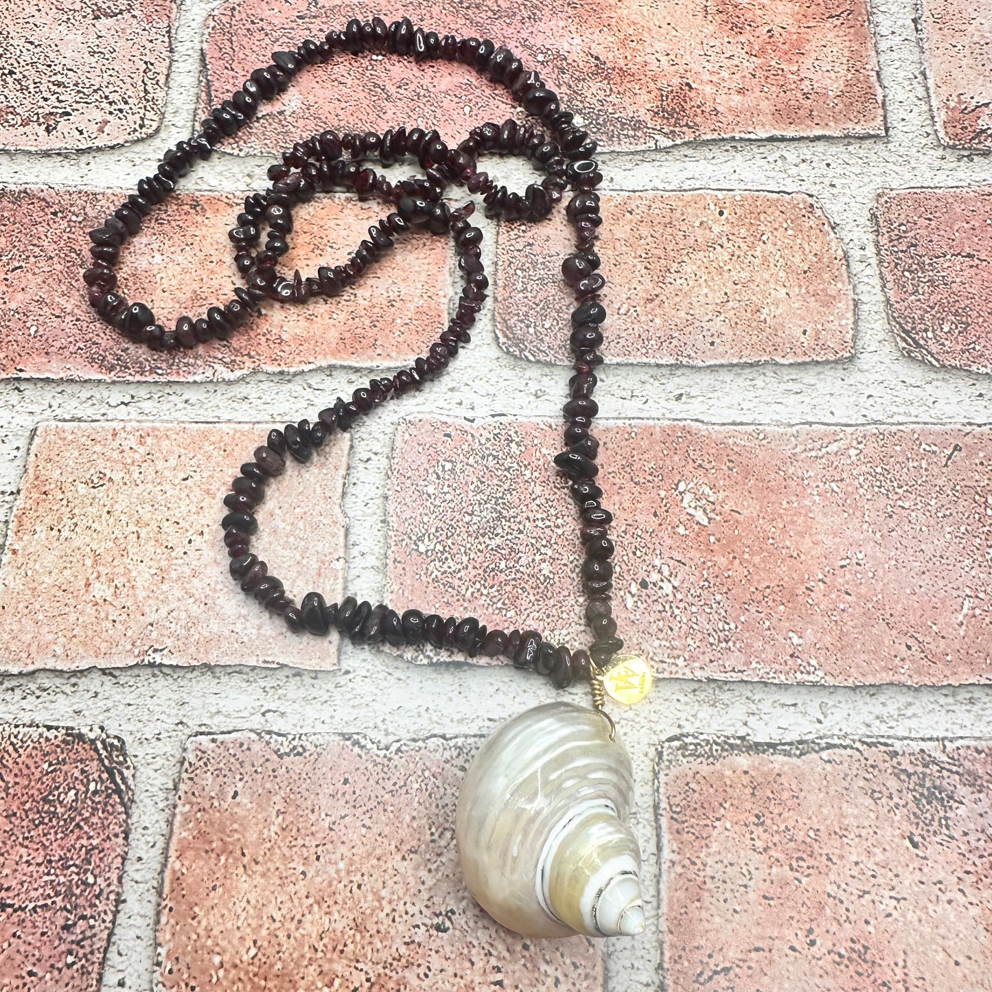 Garnet Strand with Polished shell Pendant | Erika Williner Designs