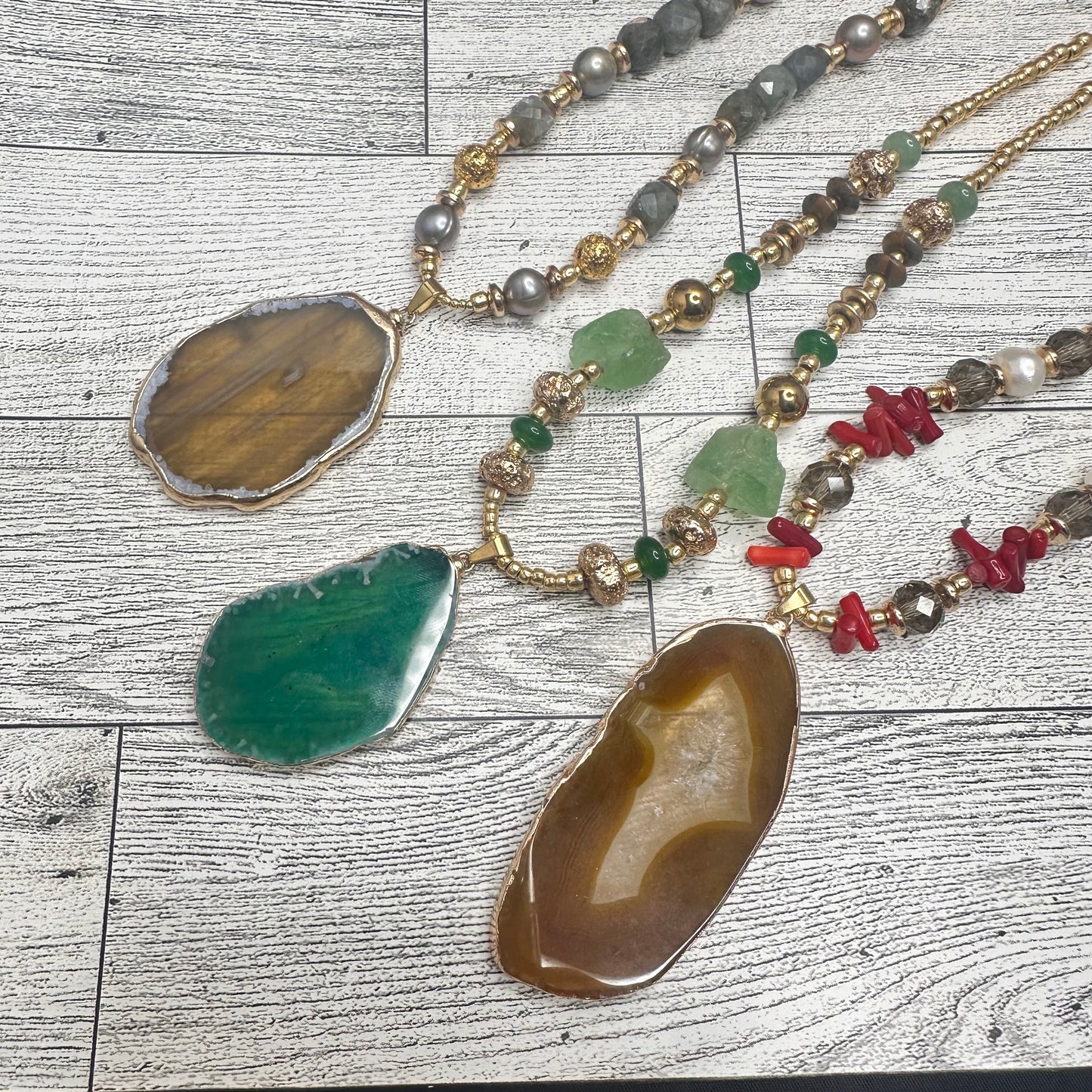 Brown Agate Pendant with Smoky Faceted Crystals, Red Coral Branches, Faceted Citrines, Fresh Water Pearls, Lava Rock and Golden Glass seed Beads | Erika Williner Designs