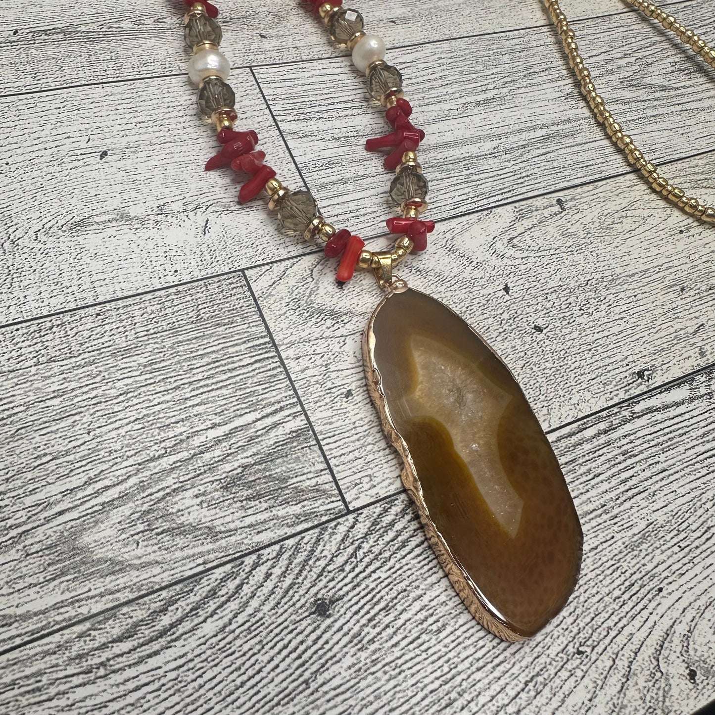 Brown Agate Pendant with Smoky Faceted Crystals, Red Coral Branches, Faceted Citrines, Fresh Water Pearls, Lava Rock and Golden Glass seed Beads | Erika Williner Designs