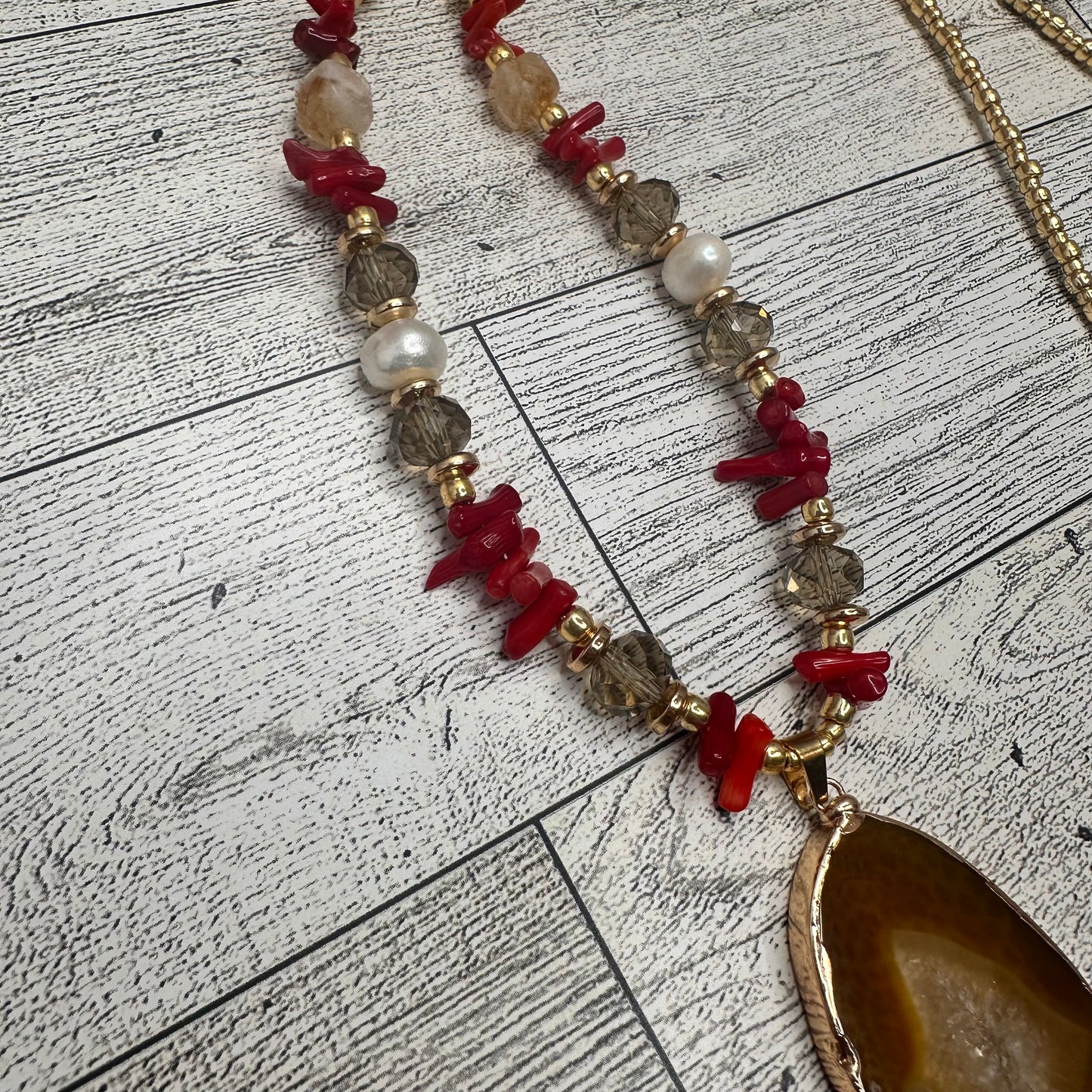 Brown Agate Pendant with Smoky Faceted Crystals, Red Coral Branches, Faceted Citrines, Fresh Water Pearls, Lava Rock and Golden Glass seed Beads | Erika Williner Designs