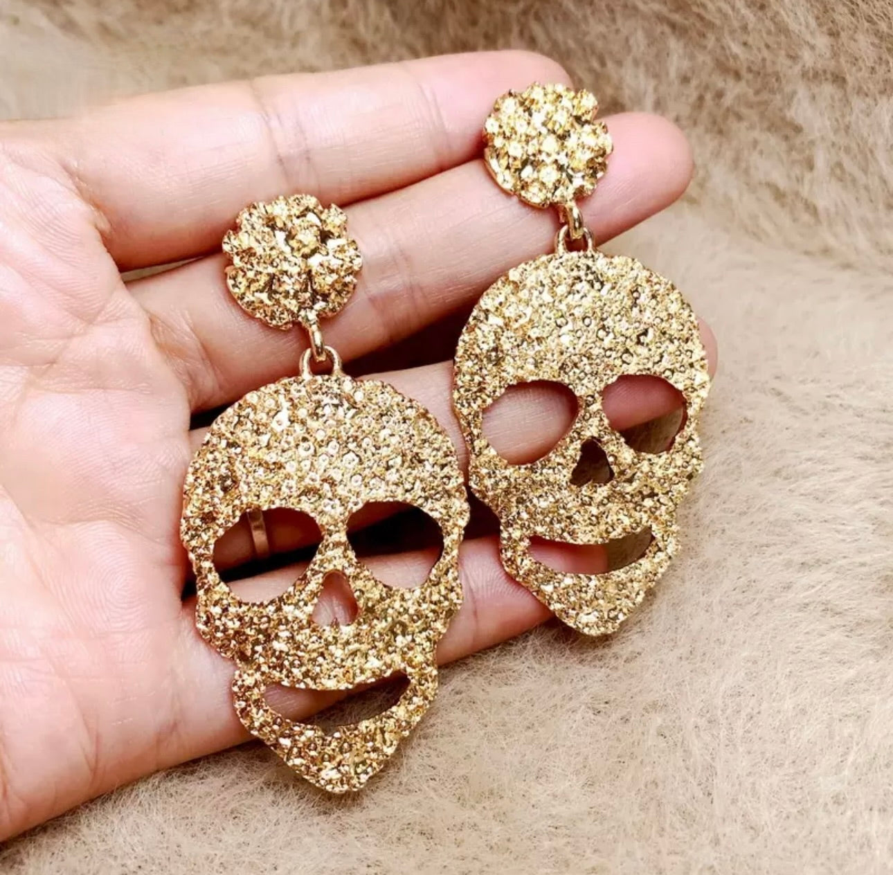 gold alteration of skull earrings