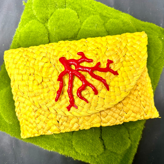 yellow straw clutch with red coral