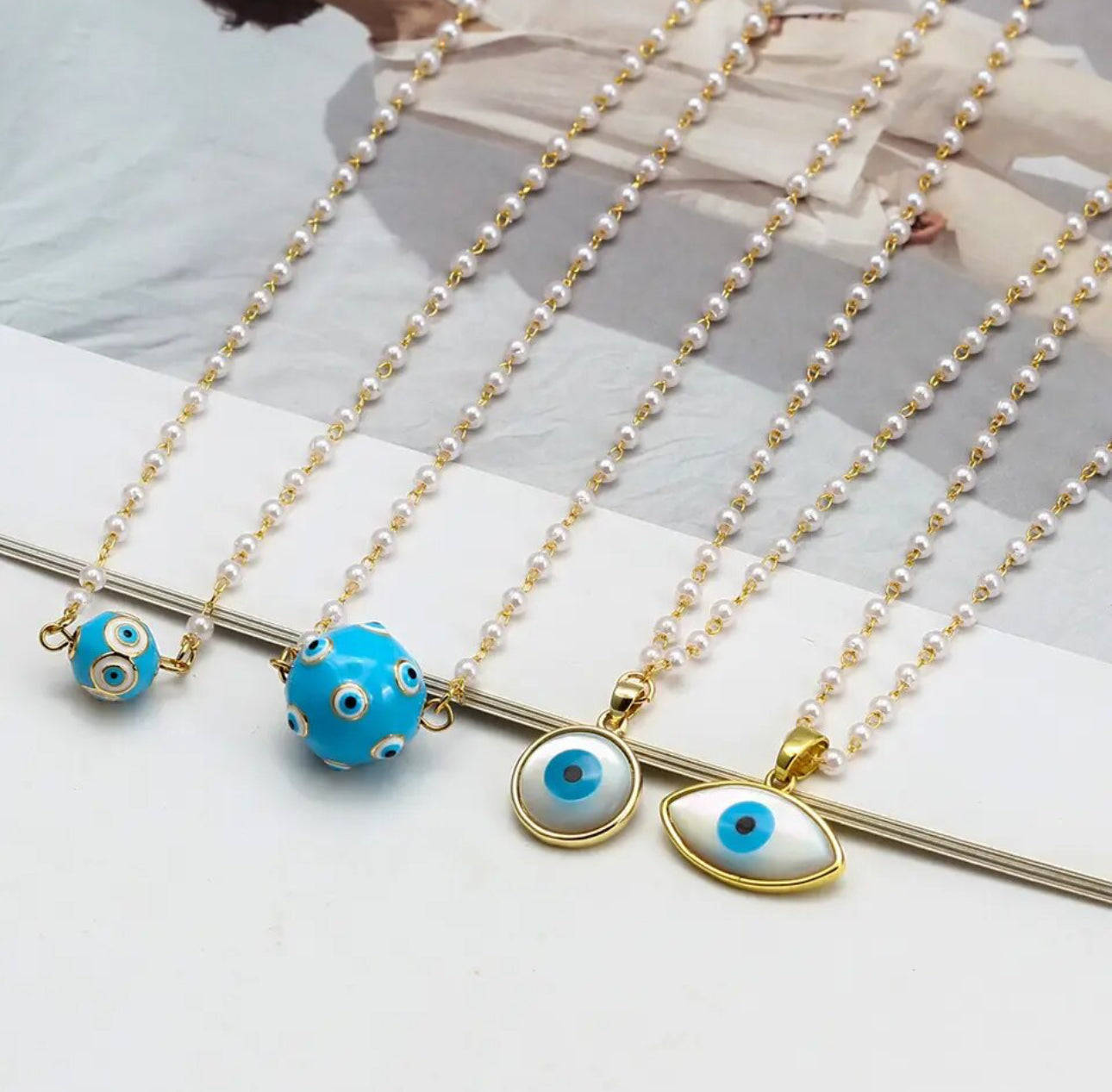 group of necklaces with evil eye Erika Williner Designs 
