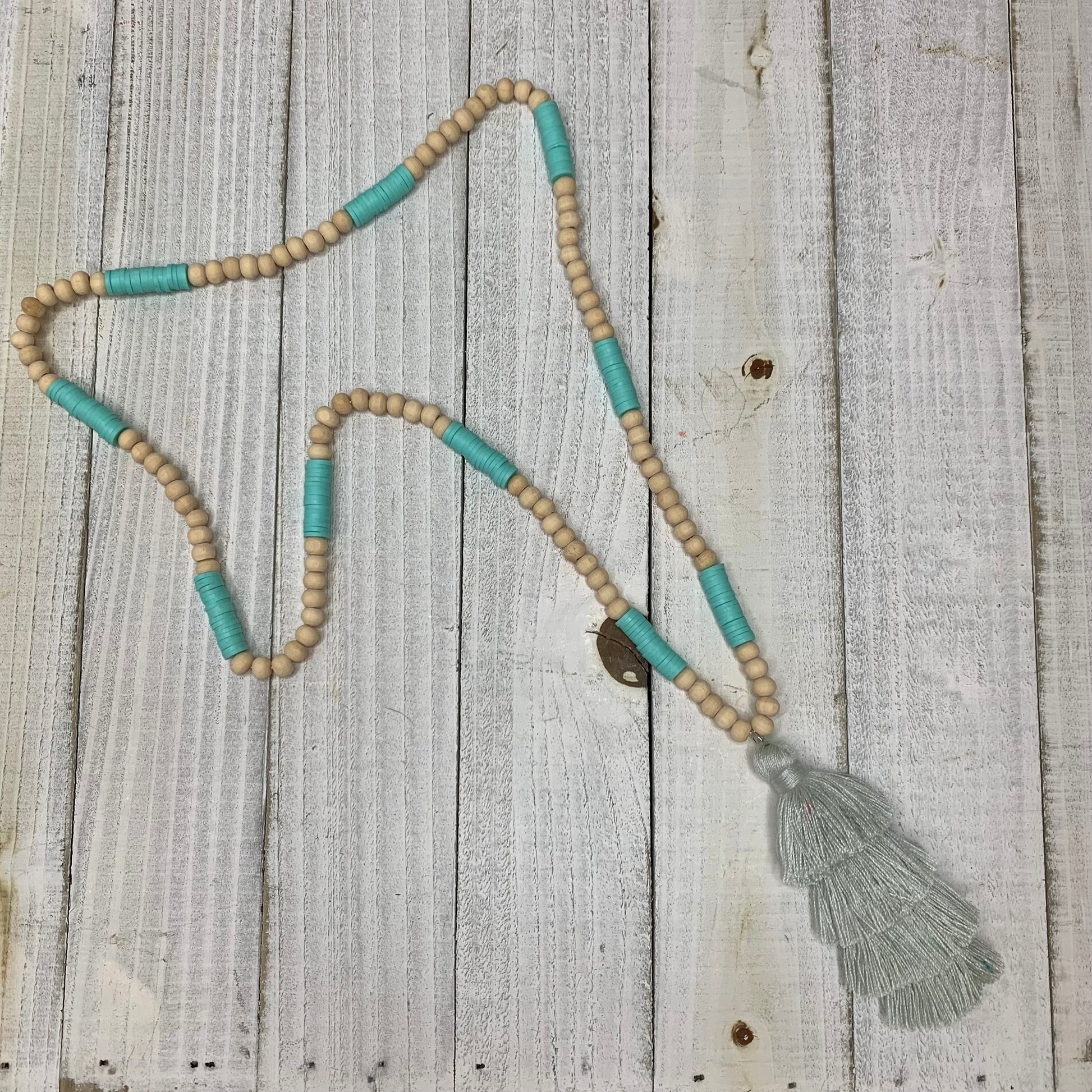 Wooden Round Beads, baby Blue Doughnut Beads with a Grey Cotton Tassel Necklace
