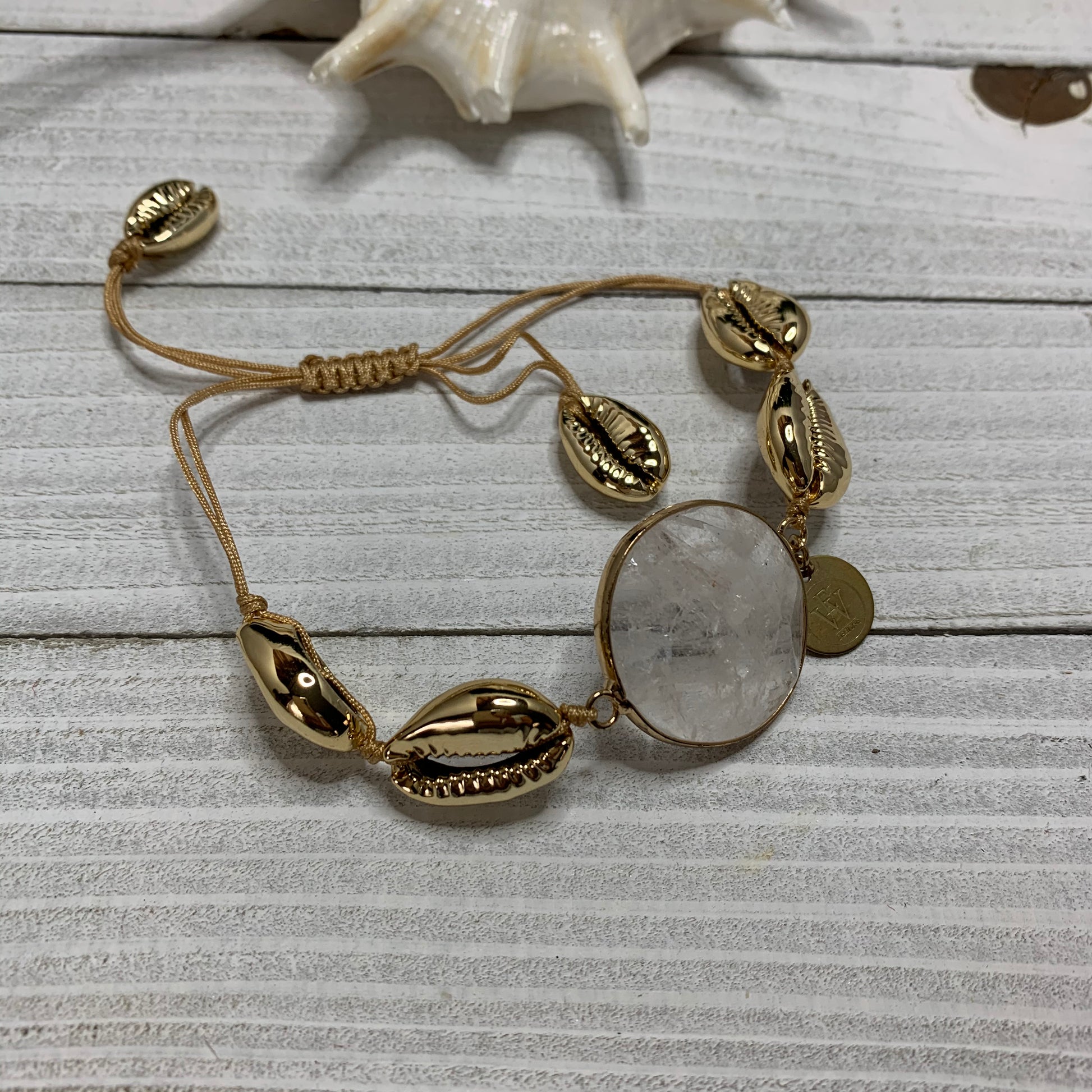 Gold plated Cowry Shells Bracelet with a Faceted Quartz Connector