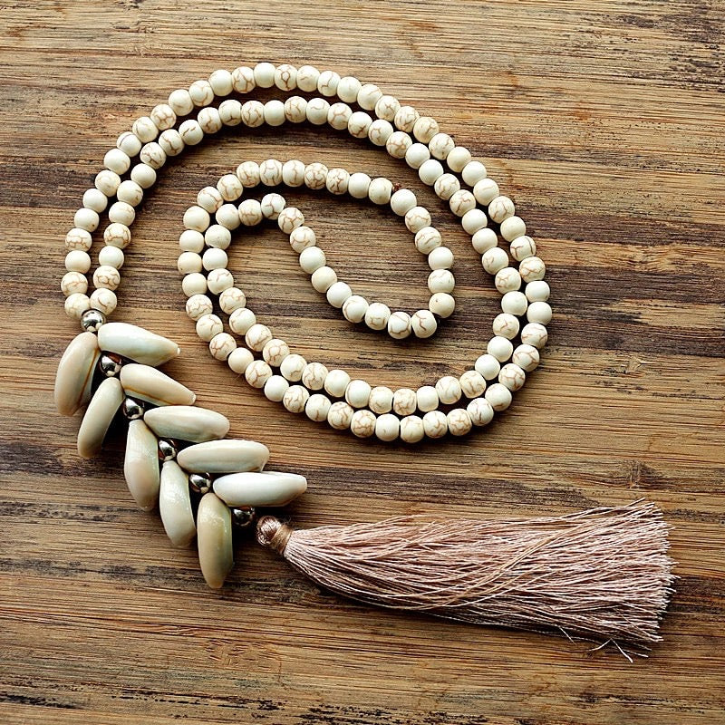Long strand of White Magnesite Beads with Cowry Shells, Silk Tassel