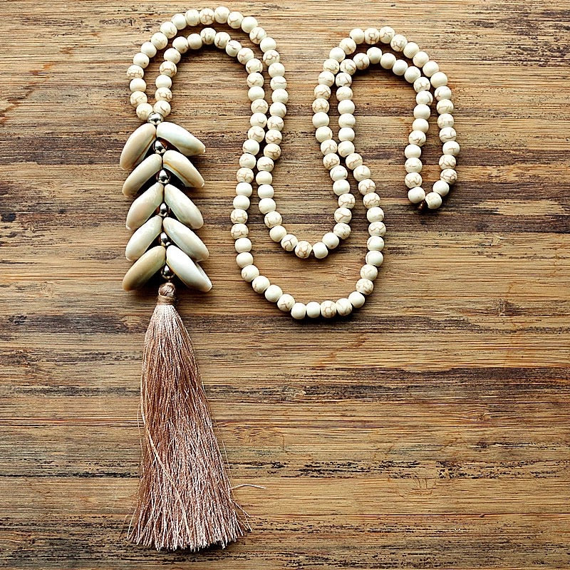 Long strand of White Magnesite Beads with Cowry Shells and Silk Tassel