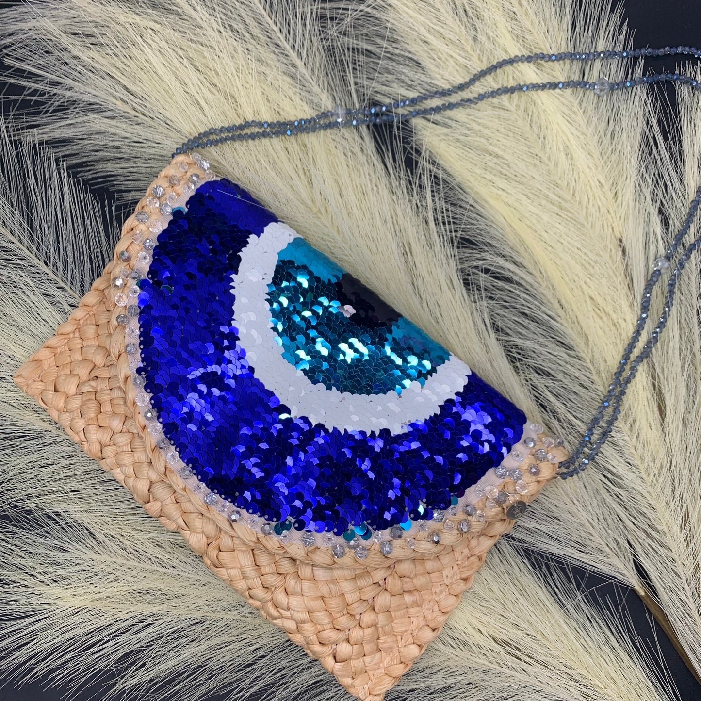 Evil Eye Straw Clutch made out of sequins