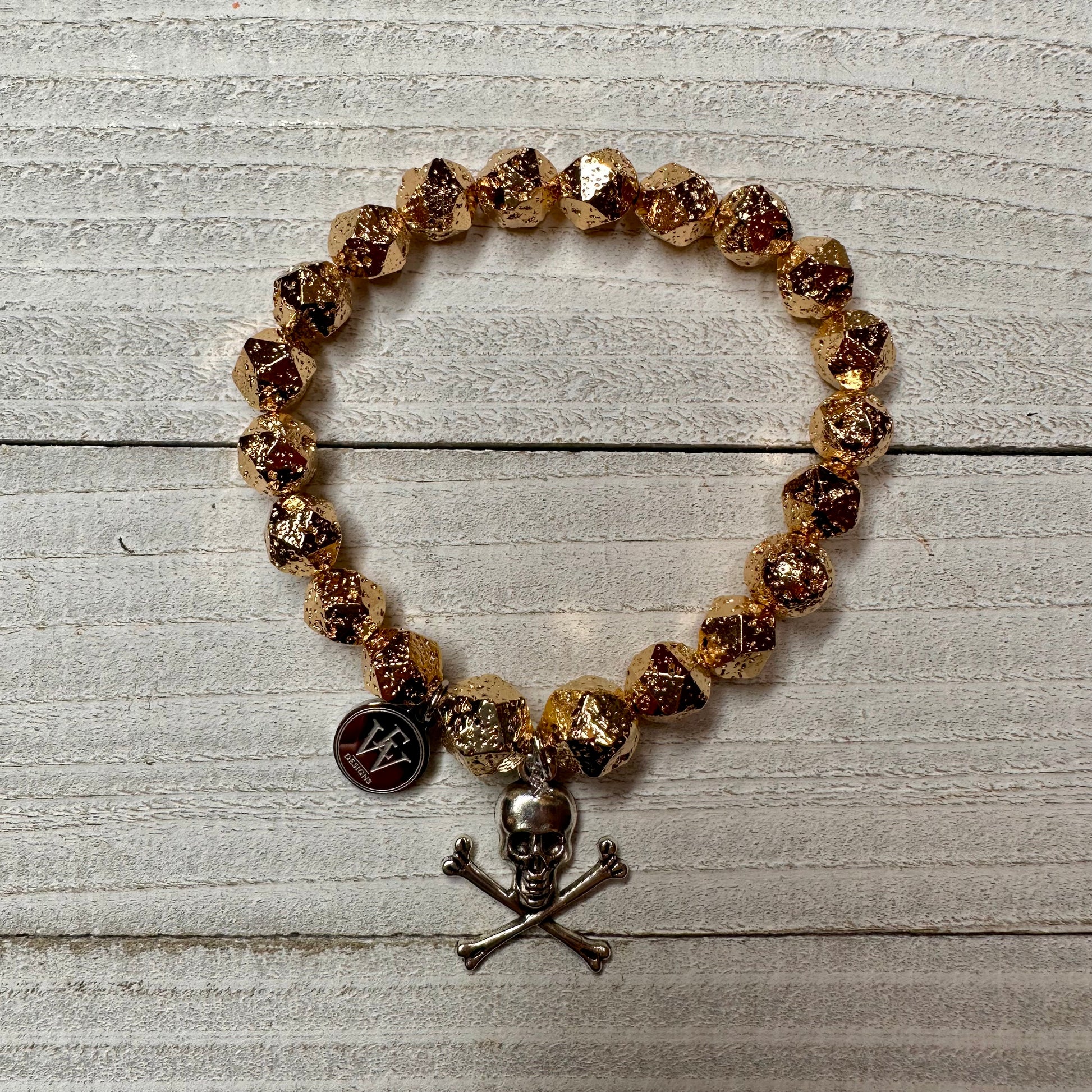 Gold Plated Hematite Beads Bracelet with a Metal Crossed Bones and Skull Charm