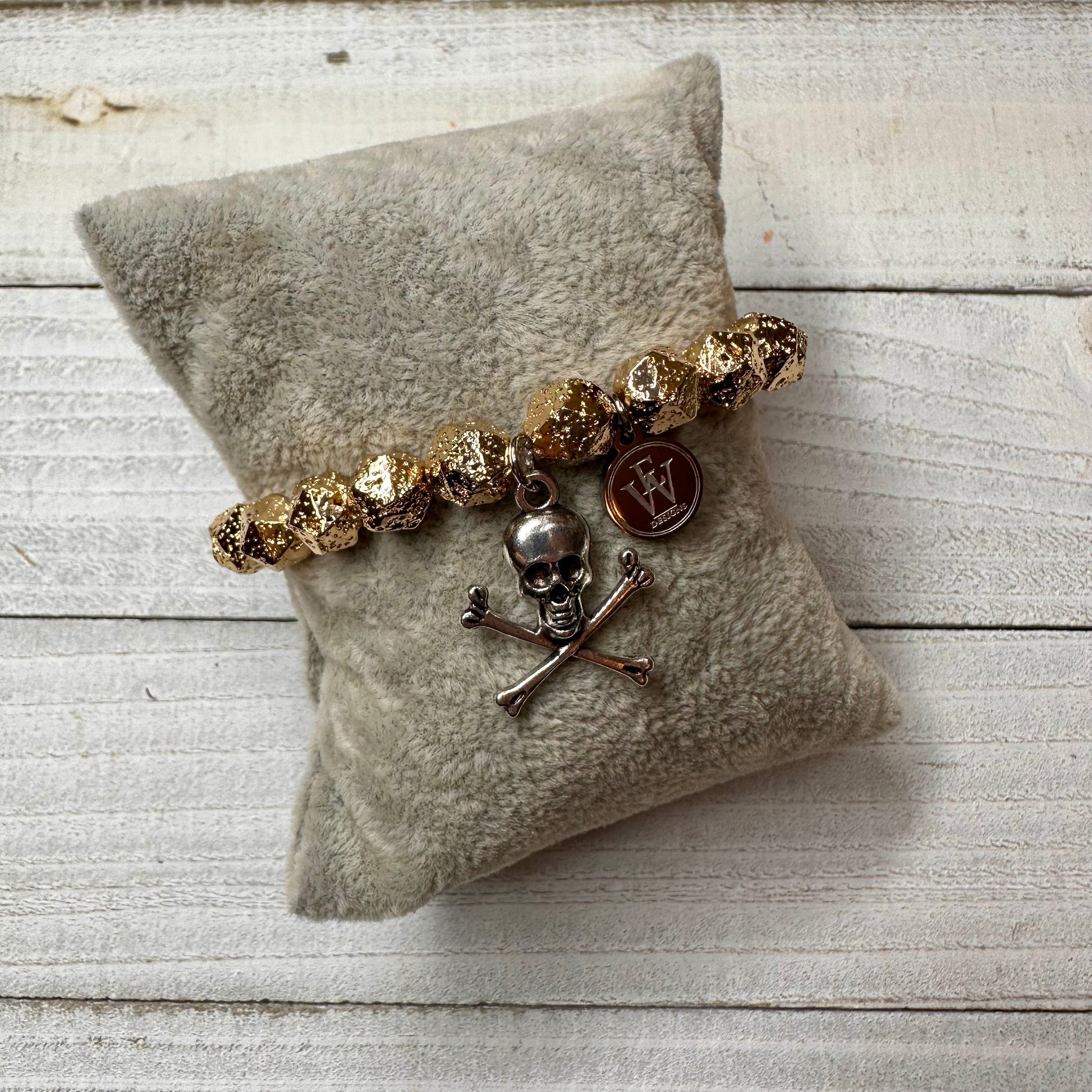 Faceted Gold Plated Hematite Beads Bracelet with a Metal Crossed Bones and Skull Charm
