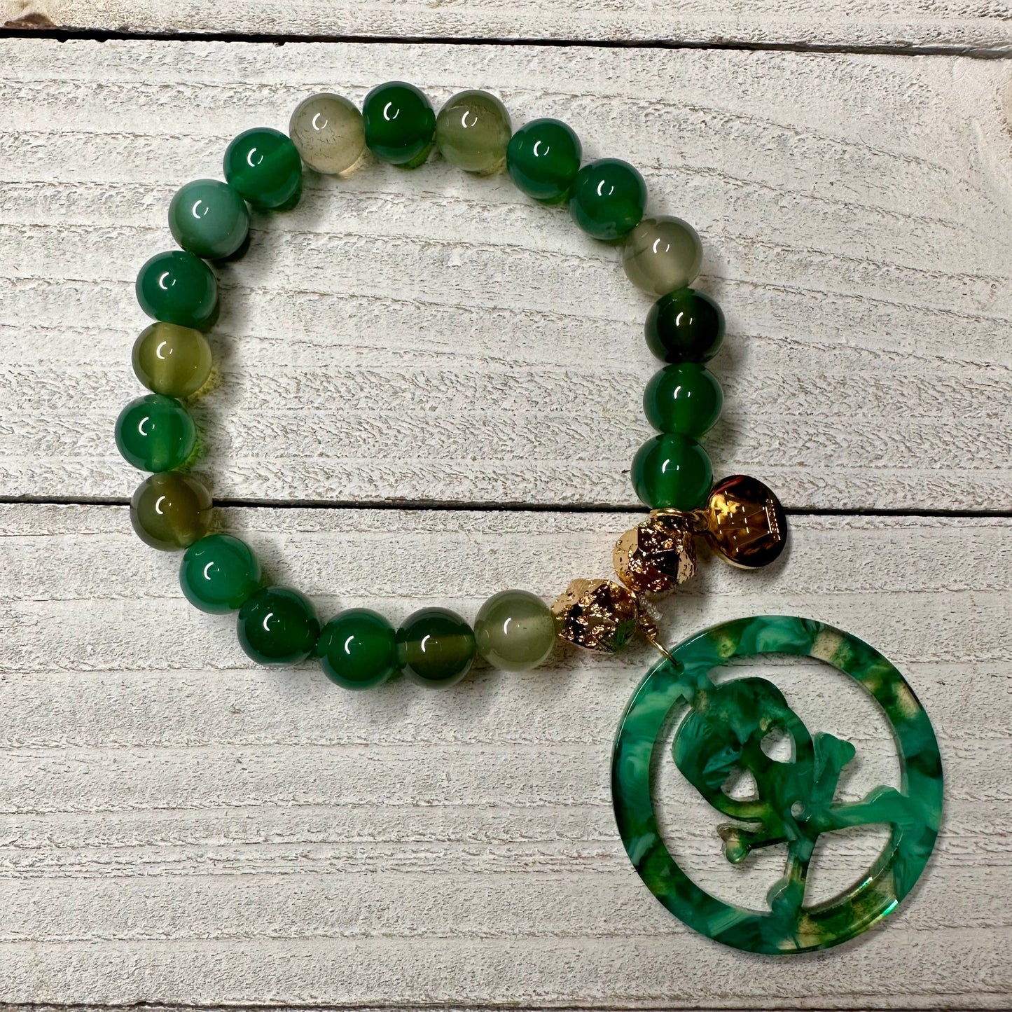 Green 6mm Agate Beads Bracelet with an acetate crossbones and skull charm