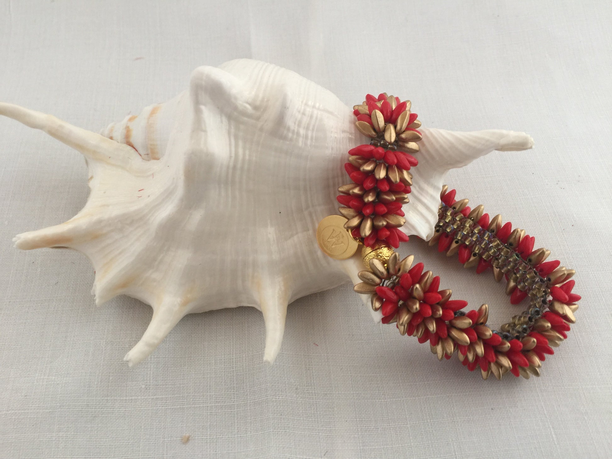 Gold and red caterpillar bracelet
