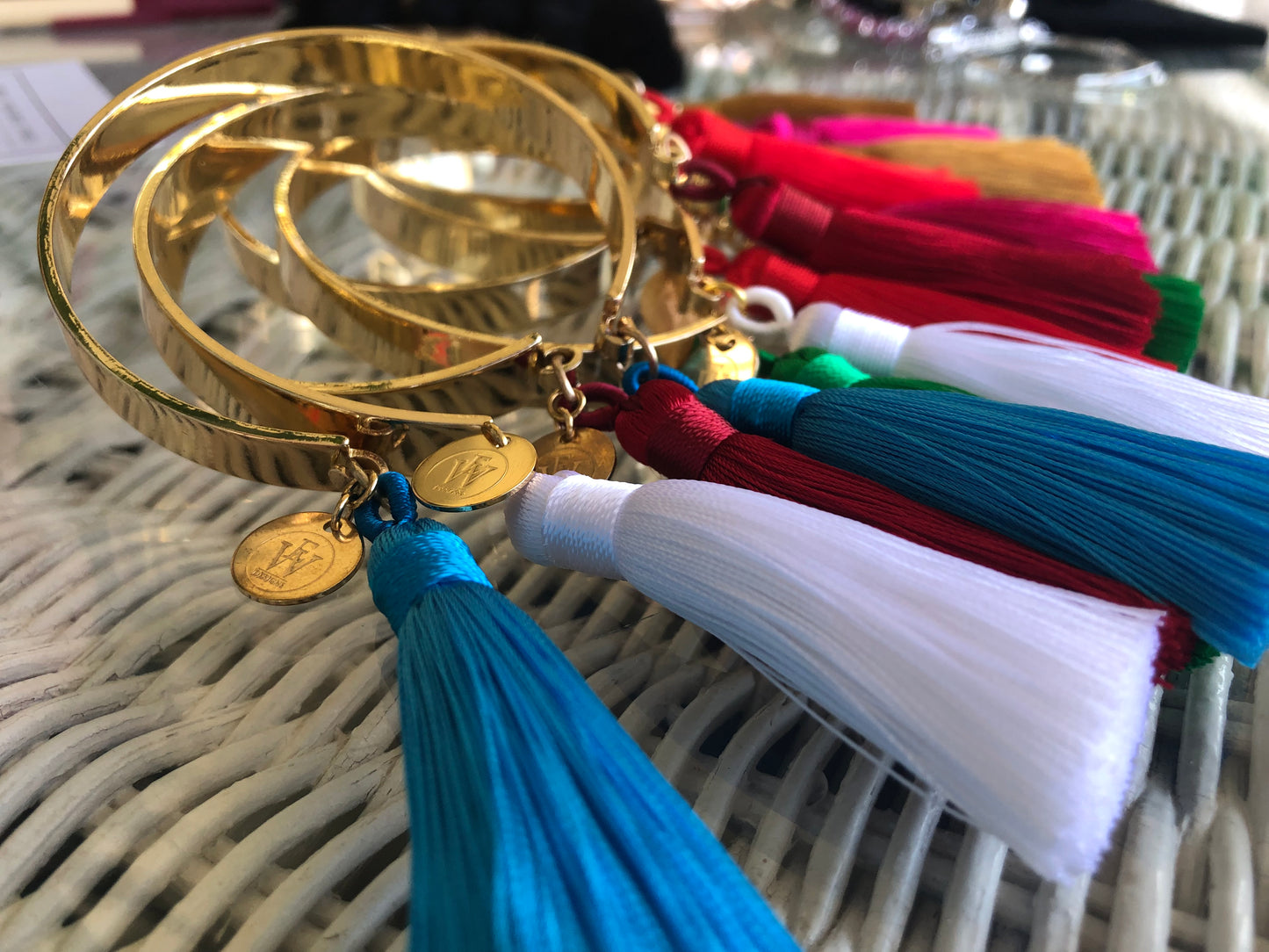 Erika Williner Designs - Golden open bangle with tassels